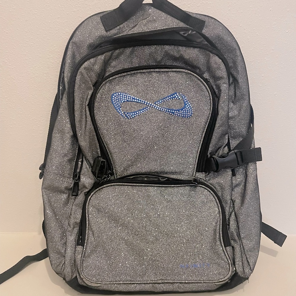 Nfinity backpack. Metallic silver w/blue logo. Like new-used gently two times.
